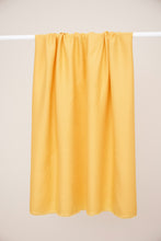 Load image into Gallery viewer, EcoVero Viscose Leia Crepe Fabric hangs over a rod