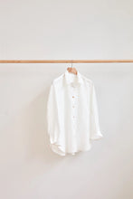 Load image into Gallery viewer, Classic Shirt hangs on a wooden hanger on a wooden rail
