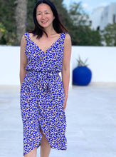Load image into Gallery viewer, Lady stands wearing sleeveless cross-over dress made using the 'Esquisse' pattern Viscose Poplin fabric