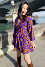 Load image into Gallery viewer, Lady wears a knee length, V neck dress made up in Purple Rain Viscose Twill Fabric