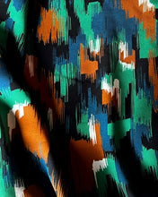 Load image into Gallery viewer, Viscose Twill fabric shown in movement shows fluid drape
