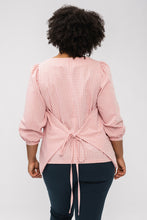Load image into Gallery viewer, Back view of lady with wrap ties at waist back