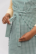 Load image into Gallery viewer, Close up view of wrap ties at waist level of Lilja Pinafore