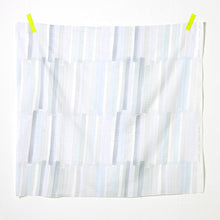 Load image into Gallery viewer, Square of bold pen-strokes design on organic cotton double gauze fabric hangs by tape on top two corners
