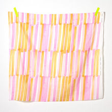 Load image into Gallery viewer, Square piece of bold pen strokes design on organic cotton double gauze fabric hangs by tape of top two corners