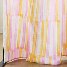 Load image into Gallery viewer, Bold pen strokes design on organic cotton double gauze fabric hangs on rail