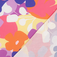 Load image into Gallery viewer, Eco Viscose fabric with a bold, retro-style floral pattern, displayed with its reverse side (faint print) lain atop