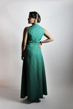 Load image into Gallery viewer, Back view of lady wearing a sleeveless dress with a-line skirt