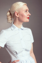 Load image into Gallery viewer, Lady wears a short sleeve button up shirt with rounded collar, with waist to bust darts
