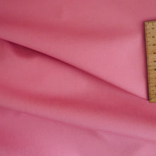 Load image into Gallery viewer, Organic cotton fabric displayed in soft folds with wooden ruler