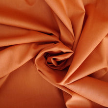 Load image into Gallery viewer, Organic cotton poplin fabric shown with central swirl