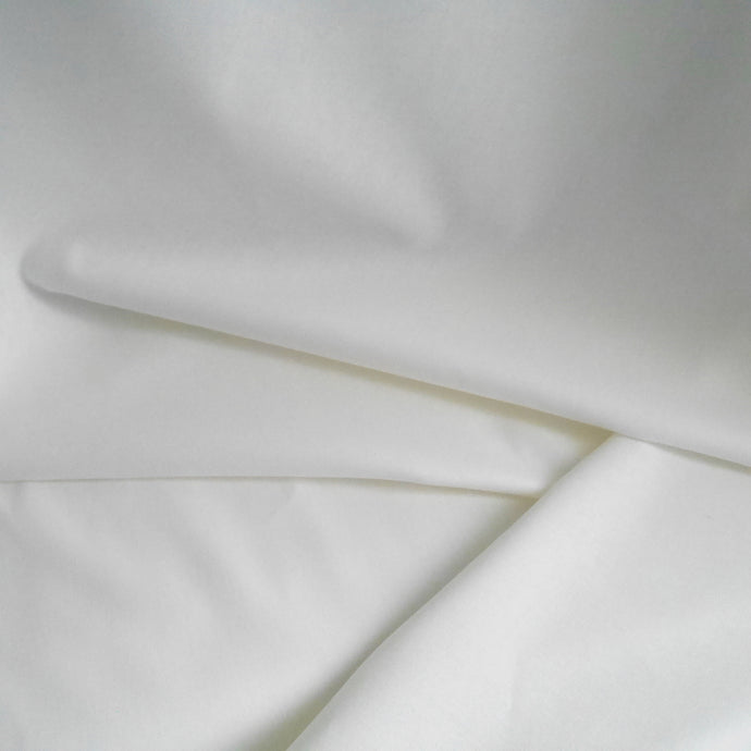 Organic Cotton Poplin fabric laid in soft folds