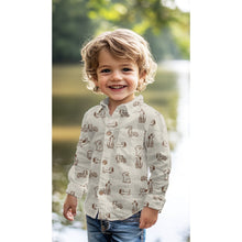Load image into Gallery viewer, Young model wears a shirt made of illustrated dogs print on organic cotton poplin fabric