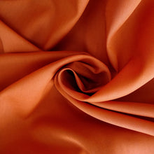 Load image into Gallery viewer, Organic cotton voile fabric shown with central swirl