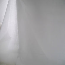 Load image into Gallery viewer, Organic Cotton Voile Fabric hangs with light shining through