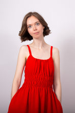 Load image into Gallery viewer, Model wears a sleeveless dress, with rounded neckline, hands in side pockets