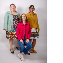 Load image into Gallery viewer, Three models of various sizes wearing the Jan Jacket: a loose-fitting jacket with sunburst tucks around the neckline.