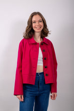 Load image into Gallery viewer, Model wears a loose-fitting jacket with sunburst tucks around the neckline, and patch pockets, worn open
