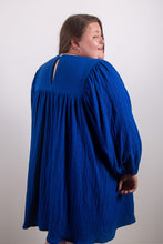 Load image into Gallery viewer, Back view of model wearing loose-fitting dress. Gathered sleeves and gather detail into yoke
