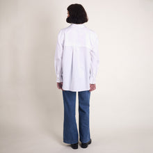 Load image into Gallery viewer, Back view of model wearing long-sleeve shirt made with Oxford Cotton fabric