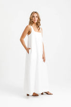 Load image into Gallery viewer, Lady wears full length dress with square-scoop neckline, hand in side pocket at hip level