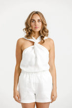 Load image into Gallery viewer, Lady wears a top with cross over halter neck, tucked into a pair of shorts.