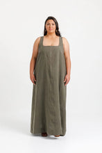 Load image into Gallery viewer, Lady stands wearing full length dress, with low square-scoop neckline