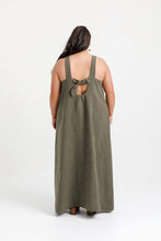 Load image into Gallery viewer, Back view of lady wearing full length dress with low scoop back neckline with a tie across at chest level