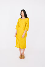 Load image into Gallery viewer, Front view of lady wearing 3/4 sleeve length Ravine Dress with bias-cut skirt