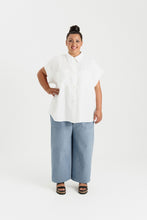 Load image into Gallery viewer, Lady wears a short sleeved, button up shirt with patch pockets at chest
