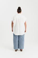Load image into Gallery viewer, Back view of lady wearing a short sleeve shirt, hem at thigh level