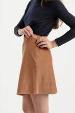 Load image into Gallery viewer, Close up detail of short skirt, bias cut, invisible zip at side seam with button at the waistband