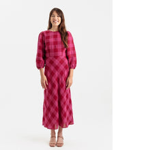 Load image into Gallery viewer, Lady wears a long puff sleeve dress with bias cut skirt, midi length