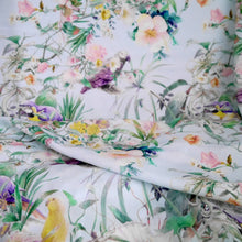 Load image into Gallery viewer, Viscose fabric with print of parrots florals, displayed with soft folds