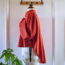 Load image into Gallery viewer, Side view, displayed on mannequin is a shirt cropped at the front but hangs low at the back, made in Viscose Twill fabric
