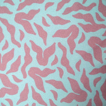 Load image into Gallery viewer, Close up of EcoVero Viscose Twill fabric showing 'Evolve' design print of scattering leaves