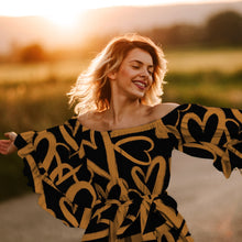 Load image into Gallery viewer, Model wears an off-the-shoulder, tie waist dress, digitally made in the Full EcoVero Viscose Fabric