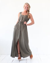 Load image into Gallery viewer, Lady wears The Southport Dress by True Bias: a button up front tank top with elasticated waist and A-line maxi skirt with split up centre front to above knee level