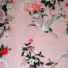 Load image into Gallery viewer, Viscose Fabric with oversized blooms amongst storks mid-flight pattern, displayed flat