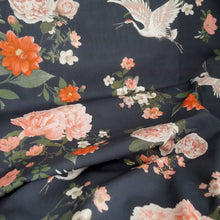 Load image into Gallery viewer, Cotton fabric with oversized blooms, and storks in mid-flight pattern, displayed in drapes