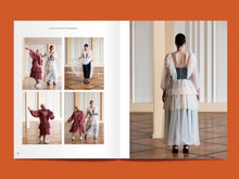 Load image into Gallery viewer, Double paged magazine spread featuring images of two ladies wearing sheer, tiered dresses for an ethereal look