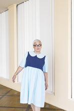 Load image into Gallery viewer, Lady wears a dress with peter pan collar, body block in contrasting colour to the rest
