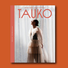 Load image into Gallery viewer, Lady wears a sheer, tiered tulle dress, with ruffles along v-neckline