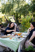 Load image into Gallery viewer, Two ladies chatting and eating at a picnic table wearing gathered neckline blouses