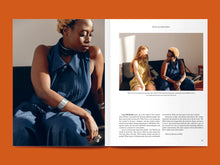 Load image into Gallery viewer, Magazine spread features photos of two women wearing a pointed collar, sleeveless dress, with pleated front bodice. Right photo above article text