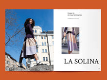 Load image into Gallery viewer, Magazine spread features photo of lady wearing a tiered skirt, alongside title: "La Solina".