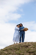 Load image into Gallery viewer, Two ladies stand on rock wearing wrap-across robes