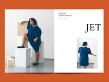 Load image into Gallery viewer, A two-page spread features lady wearing denim knee-length dress with puffed sleeves, alongsides the word 'Jet'.