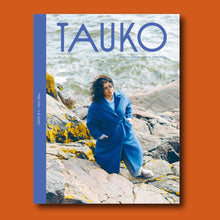 Load image into Gallery viewer, TAUKO magazine cover features a lady wearing a wool coat standing on a rock