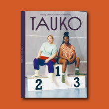 Load image into Gallery viewer, TAUKO magazine cover features two people sat on winning sports podium